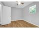 Sunlit bedroom offering hardwood flooring, neutral walls and a ceiling fan at 507 Stinson Dr # 4G, Charleston, SC 29407