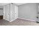Neutral bedroom featuring tile flooring and crisp white doors at 507 Stinson Dr # 4G, Charleston, SC 29407