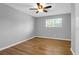 Neutral bedroom showing wood-look floors, a ceiling fan, and bright window at 507 Stinson Dr # 4G, Charleston, SC 29407