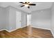 Bedroom with hardwood flooring, ceiling fan, and two access doors at 507 Stinson Dr # 4G, Charleston, SC 29407