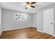 Sun-filled bedroom featuring hardwood floors, a ceiling fan and window at 507 Stinson Dr # 4G, Charleston, SC 29407