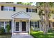 Charming townhome with a well-maintained lawn, brick facade, black shutters, and inviting entranceway at 507 Stinson Dr # 4G, Charleston, SC 29407