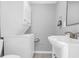 Bathroom with laundry area featuring stacked washer and dryer near a sink at 507 Stinson Dr # 4G, Charleston, SC 29407