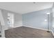 Living room featuring wood-look tile flooring, fresh paint, and access to the kitchen area at 507 Stinson Dr # 4G, Charleston, SC 29407