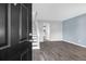 The living room boasts stylish wood-look tile flooring, modern paint and trim, and a staircase at 507 Stinson Dr # 4G, Charleston, SC 29407