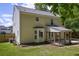 Two-story home featuring a covered patio, bay window, and well-maintained lawn at 5105 Parrum Ct, Summerville, SC 29485