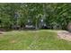 Expansive, well-maintained backyard featuring lush greenery and mature trees, ideal for outdoor enjoyment at 5105 Parrum Ct, Summerville, SC 29485