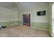 Spacious bedroom with carpet, light green and white walls, a ceiling fan, and access to an adjacent room at 5105 Parrum Ct, Summerville, SC 29485