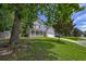 Beautiful two-story home with a brick and siding facade, featuring a cozy front porch and lush green lawn at 5105 Parrum Ct, Summerville, SC 29485