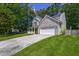 Inviting two-story home featuring a blend of brick and siding, complemented by a covered front porch and spacious driveway at 5105 Parrum Ct, Summerville, SC 29485