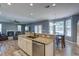 Open-concept kitchen with granite countertops, stainless appliances, and views of living spaces at 5105 Parrum Ct, Summerville, SC 29485