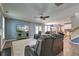 Open-concept living room with hardwood floors, a large TV, comfortable seating, and an open flow to the kitchen at 5105 Parrum Ct, Summerville, SC 29485