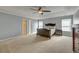 Spacious main bedroom with tray ceiling, neutral walls, carpet, and large windows at 5105 Parrum Ct, Summerville, SC 29485