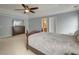 Main bedroom featuring tray ceiling, carpet, tv, and a glimpse of the ensuite bathroom at 5105 Parrum Ct, Summerville, SC 29485
