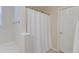 Bathroom featuring a white shower curtain, white walls, and neutral tile flooring at 5105 Parrum Ct, Summerville, SC 29485