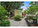 Inviting backyard retreat with cozy seating area, lush landscaping, and charming curb appeal at 5134 E Liberty Park Cir, North Charleston, SC 29405