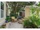 Secluded backyard with comfortable patio seating and a view of the house with beautiful greenery at 5134 E Liberty Park Cir, North Charleston, SC 29405