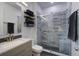Modern bathroom with glass-enclosed shower, a sleek vanity, and tiled floors, lots of natural light at 5134 E Liberty Park Cir, North Charleston, SC 29405