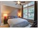 Cozy bedroom featuring a ceiling fan, carpet flooring, and a large window with lots of natural light at 5134 E Liberty Park Cir, North Charleston, SC 29405