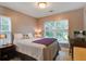 Cozy bedroom with neutral decor, large windows providing natural light, and comfortable furnishings at 5134 E Liberty Park Cir, North Charleston, SC 29405