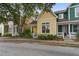 Charming two-story home with yellow siding, white trim, inviting porch, and well-maintained lawn at 5134 E Liberty Park Cir, North Charleston, SC 29405