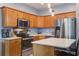 Well-equipped kitchen featuring stainless steel appliances and quartz countertops, lots of natural light at 5134 E Liberty Park Cir, North Charleston, SC 29405