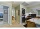 Conveniently located laundry area featuring modern stacked washer/dryer and an adjacent office space at 5134 E Liberty Park Cir, North Charleston, SC 29405