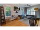 Comfortable living room featuring hardwood floors, lots of natural light, modern furnishings, and neutral colors at 5134 E Liberty Park Cir, North Charleston, SC 29405