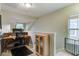 Functional home office space featuring a built-in desk, carpet flooring, and lots of natural light at 5134 E Liberty Park Cir, North Charleston, SC 29405