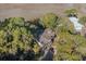 Charming house surrounded by lush trees and landscaping at 520 E Huron Ave, Folly Beach, SC 29439