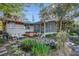 Spacious backyard featuring a pond, a fire pit, a screened porch, and a hot tub for outdoor living at 520 E Huron Ave, Folly Beach, SC 29439
