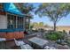 Inviting backyard with a hot tub, a screened porch and a fire pit with pond and seating area at 520 E Huron Ave, Folly Beach, SC 29439