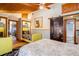 Cozy bedroom featuring a barn door, a lounge, and access to an ensuite bathroom at 520 E Huron Ave, Folly Beach, SC 29439