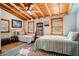 Bedroom with twin beds, and exposed beam ceiling at 520 E Huron Ave, Folly Beach, SC 29439