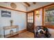 Inviting foyer with hardwood floors, a wooden door and a stylish console table creating a warm and elegant entrance at 520 E Huron Ave, Folly Beach, SC 29439