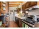 Cozy kitchen featuring wood cabinets, countertops and gas range at 520 E Huron Ave, Folly Beach, SC 29439