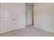 Spacious bedroom with plush carpet, a closet and view into the hallway at 528 Blue Mistflower Dr, Moncks Corner, SC 29461