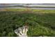Aerial view of properties bordered by creek, river, and forest at 542 Amalie Farms Dr, Charleston, SC 29492