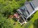 Aerial view of backyard, with deck, outdoor seating, and a well-maintained lawn at 542 Amalie Farms Dr, Charleston, SC 29492