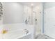 Modern bathroom with a separate bathtub and shower with glass doors at 542 Amalie Farms Dr, Charleston, SC 29492