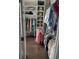 Walk-in closet with hanging clothes and shelving for bags and hats at 542 Amalie Farms Dr, Charleston, SC 29492