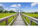 Scenic view of the marsh from a wooden boardwalk; community is in the background at 542 Amalie Farms Dr, Charleston, SC 29492
