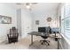 Bright home office with ceiling fan, large window with shutters, and two desk areas at 542 Amalie Farms Dr, Charleston, SC 29492