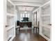 Stylish office with a tray ceiling, hardwood floors, and a barn door at 542 Amalie Farms Dr, Charleston, SC 29492