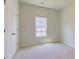 Bright, empty bedroom with carpet, a window, and a closet, ready for personalization at 549 Blue Mistflower Dr, Moncks Corner, SC 29461