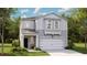 Charming two-story home featuring light gray siding, a covered porch, and an attached two-car garage at 551 Blue Mistflower Dr, Moncks Corner, SC 29461