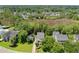 Stunning aerial view showcasing the home's location, surrounded by lush trees and a well-manicured lawn at 578 Island Walk East, Mount Pleasant, SC 29464