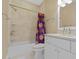 Bathroom boasts a shower-tub combination with tiled walls, single sink vanity, and Clemson shower curtain at 578 Island Walk East, Mount Pleasant, SC 29464