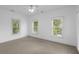 Bedroom showcases three windows bringing in ample natural light and a ceiling fan for added comfort at 578 Island Walk East, Mount Pleasant, SC 29464