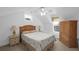 Comfortable bedroom is furnished with two side tables, two lamps, and a bed with ceiling fan at 578 Island Walk East, Mount Pleasant, SC 29464